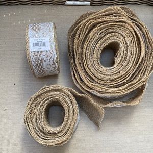 Roll of burlap ribbon with lace. One roll brand new. Other opened and used.